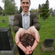 Katrina Spade, the CEO of Recompose, poses with mulch made from a dead cow in 2019.
